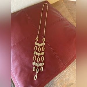 Gold tone statement necklace .